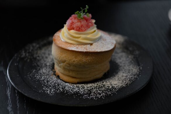 Warm spotted dick dessert served with custard.