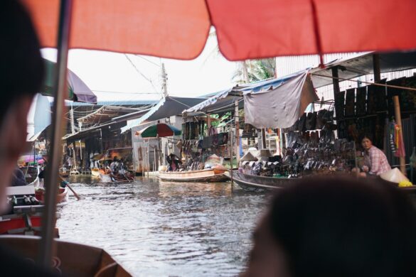 Visitors shopping at floating markets in Thailand.