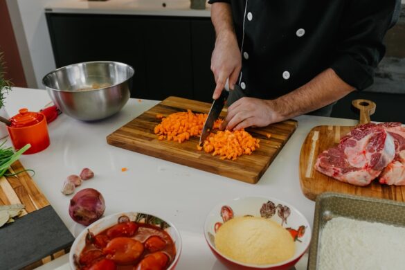 Chef preparing delicious paella.