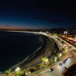 Night view of Agadir coastline with lights.