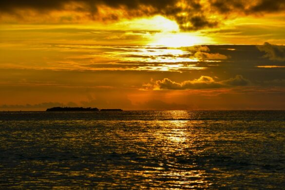 Stunning sunset view on a Maldivian beach.