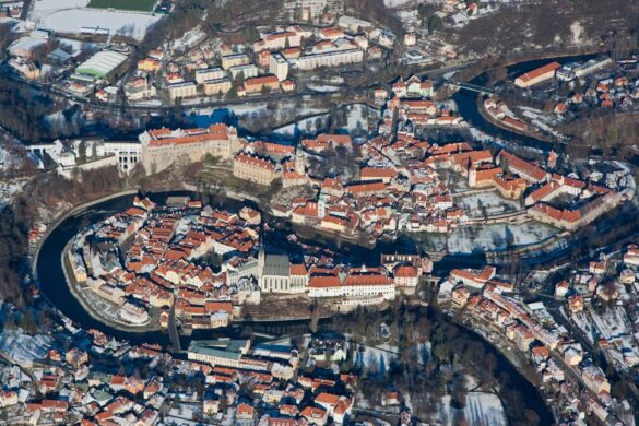 photo-1576053437997-efe2472c87ac.jpg Aerial view of Trim Castle surrounded by landscapes.