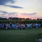 Wine festival attendees enjoying the wine tasting