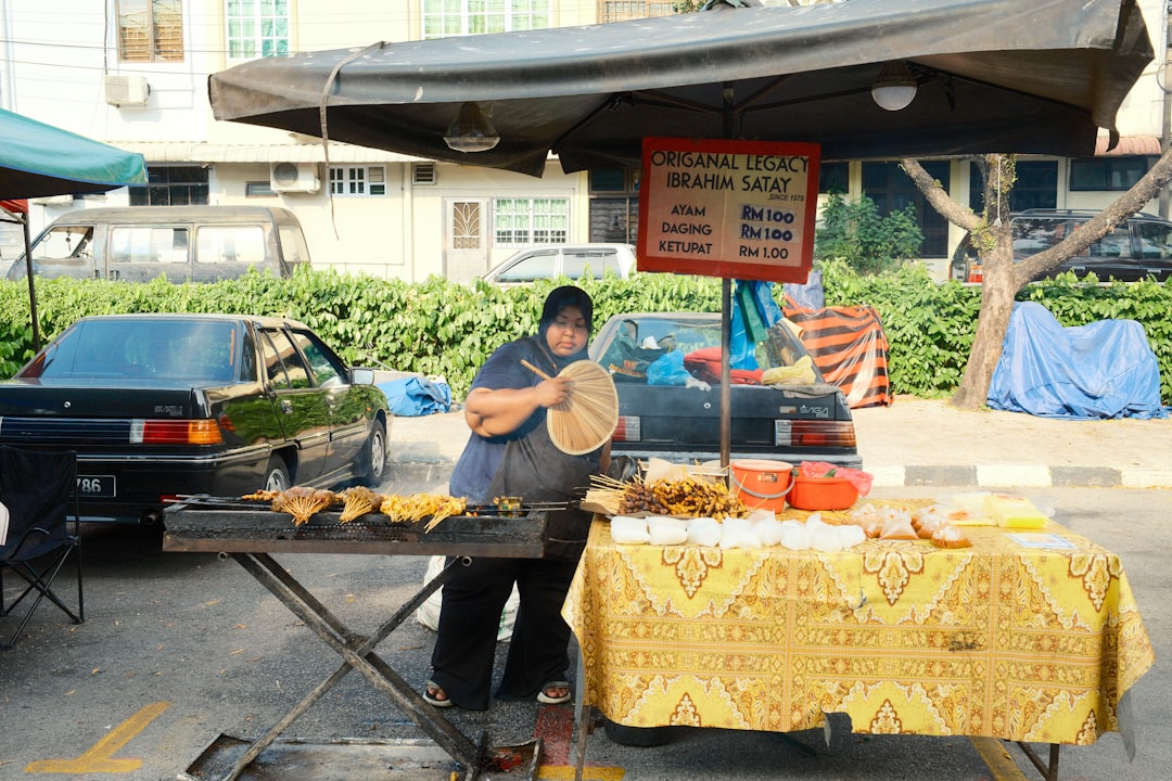 photo-1742391309558-d316d5b7933d.jpg Food stalls serving traditional Maltese dishes.