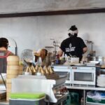 Visitors making chocolate in a Swiss workshop.